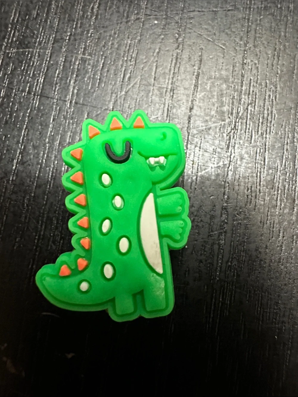 Jibbitz Green Dinosaur Shoe Charm with Orange Accents